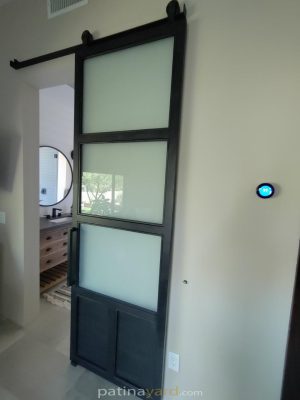 metal and satin barn door Metal and satin glass barn door with a metal toe kick