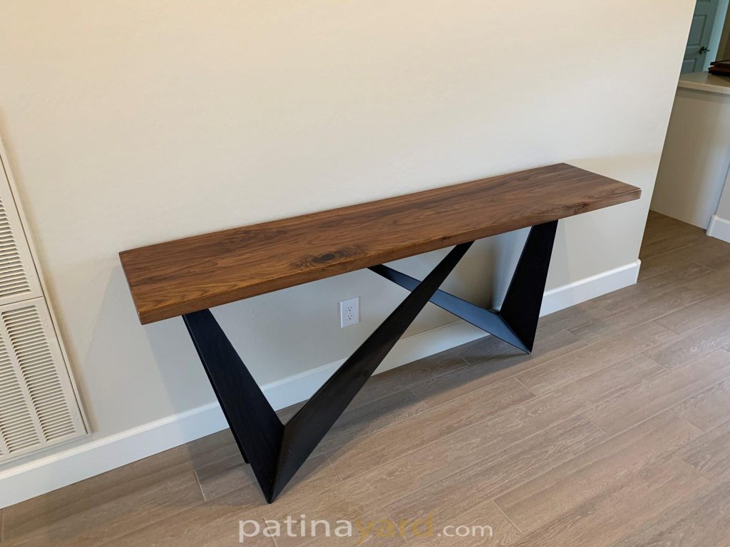 Walnut console table with angled black metal legs