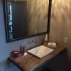 patina metal framed mirror over vanity