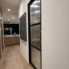 Black metal frame and fluted glass pocket door and brass hardware