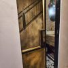 brass-steel_antique_mirrors.009 brass and metal pocket door with antique mirror