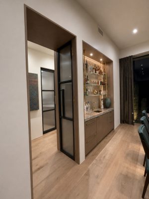 hinged-pocket-door-with-black-frame-and-fluted-glass Hinged Pocket Door Black steel frame and fluted glass