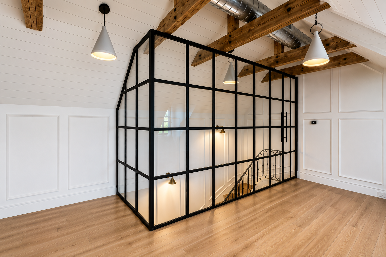 Custom black steel and glass staircase enclosure built by Patina Yard in Tampa