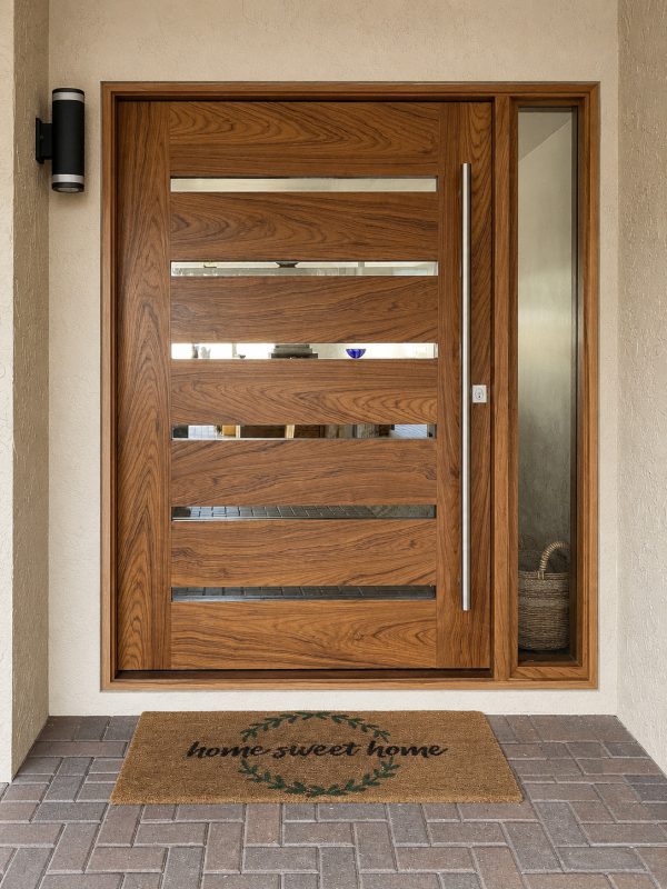 custom teak pivot door with slotted glass