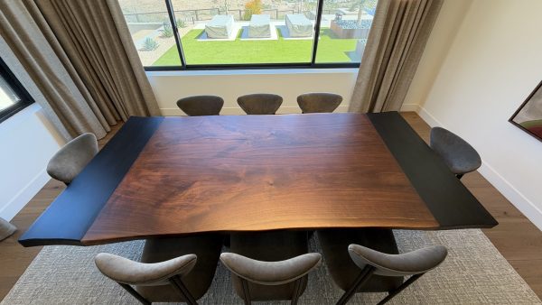 Overhead view of solid walnut live edge tabletop with blackened metal inlays in Scottsdale, Arizona