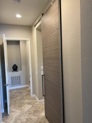 5 Panel Laminated Barn Door Gray wood grain 5 panel laminated barn door with brushed stainless trim