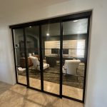 Concealed Upper Track Metal and Glass Doors and Sidelights