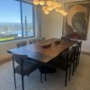 Live edge walnut dining table with blackened metal inlays and metal base in Scottsdale, Arizona