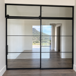 Steel and Glass Barn Door with Fixed Panel and Transom