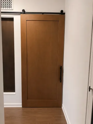 Single Panel Stained Barn Door Single panel stained alder barn door with black hardware
