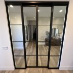 Metal and Glass Door with Concealed Upper Track