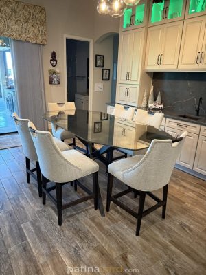 Custom antique mirror table top with a metal base in a dining area