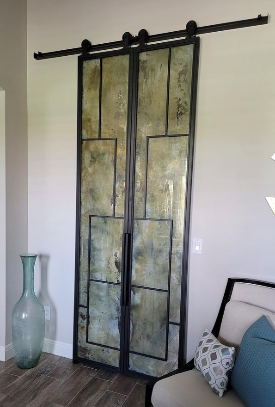 Antique Mirrors and Pattern Barn Doors Random pattern antique mirror double sliding barn doors.