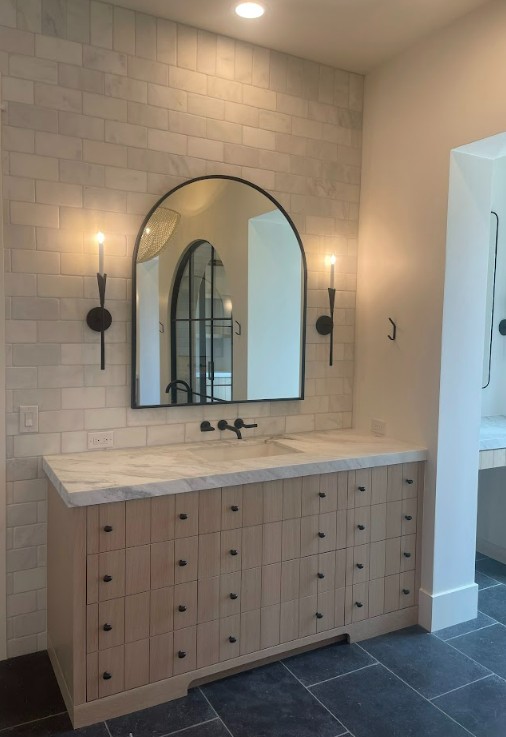 custom built arch mirror in master bath