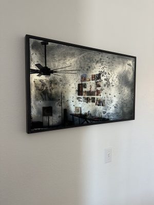 Artistic Antique Mirror Artistic antique mirror in a black frame on a white wall