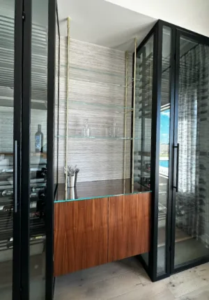 Brass Bistro with Glass Shelves Above a Walnut Cabinet brass bistro shelf unit and shelves with custom cabinet