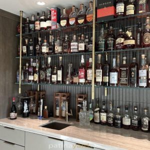 Brass and Glass Suspended Ceiling Mounted Shelves double shelf brass bistro unit