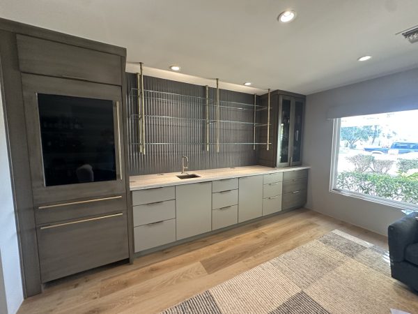 ceiling mounted brass and long extended glass shelves