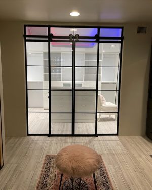 Closet Metal and Glass Barn Doors with Sidelights Black metal and glass sliding closet barn doors with sidelights and transoms