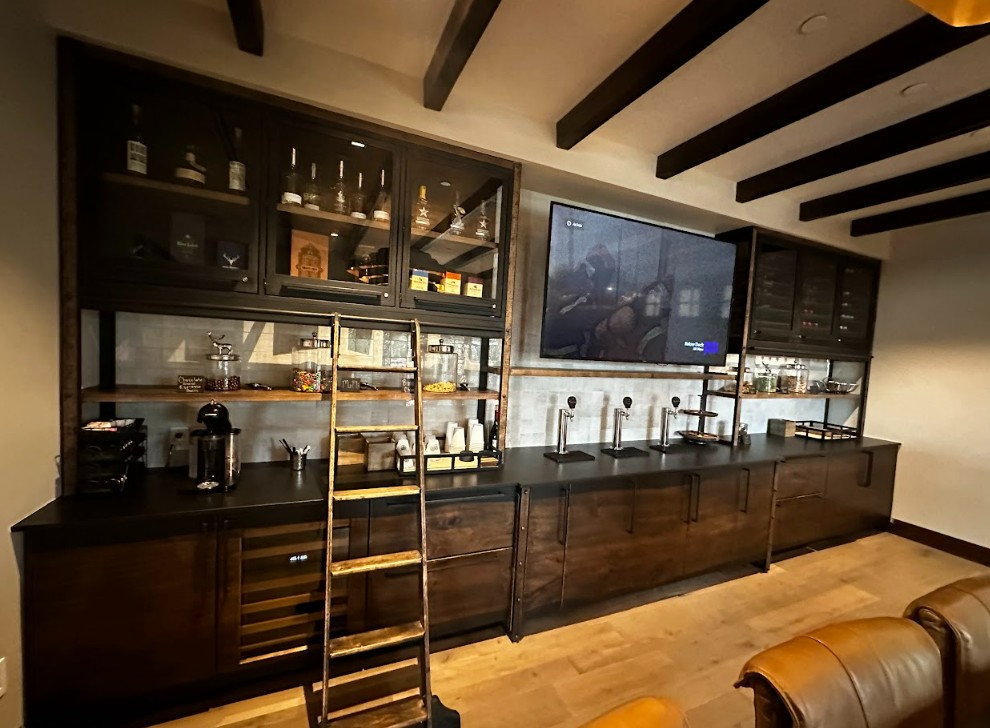 metal and glass cabinets with ladder and rail system. Live edge slab bottom cabinets