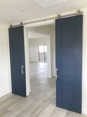 Set of Double Shaker Style Barn Doors Pair of navy blue painted shaker style barn doors