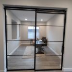 Fixed Metal and Glass Panel and Sliding Barn Door