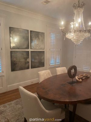 Framed Antique Mirrors Four framed antique mirrors on a dining room wall above a round table