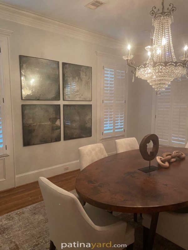 Framed Antique Mirrors Four framed antique mirrors on a dining room wall above a round table