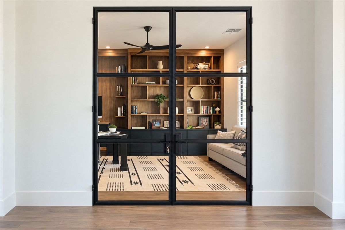 Interior double metal and glass office doors with a black steel frame
