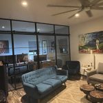 Living Room Metal and Glass Barn Door with Sidelights and Transom
