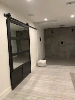 master closet mirror and metal barn door