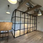 Metal and Glass Enclosure With a Hinged Door