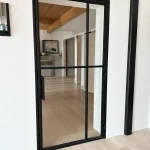 Minimalist Metal and Glass Hinged Door