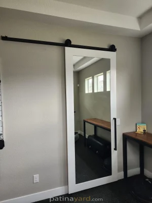 Mirrored Shaker Barn Door White painted shaker barn door with a full length mirror panel